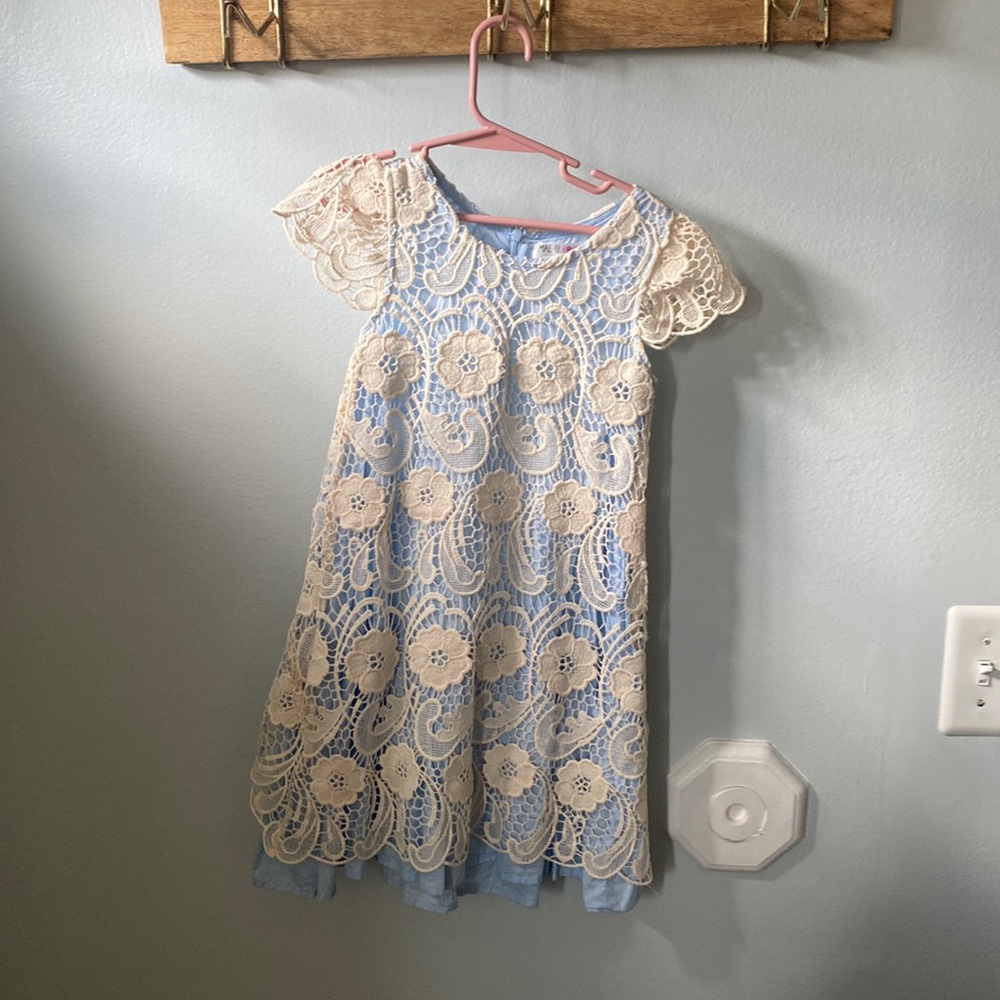 Cream lace over blue cotton. Size 5 brand Mae•LI Rose